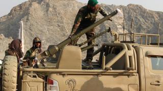 Afghan soldiers prepare a mortar to respond to Pakistan's attack.