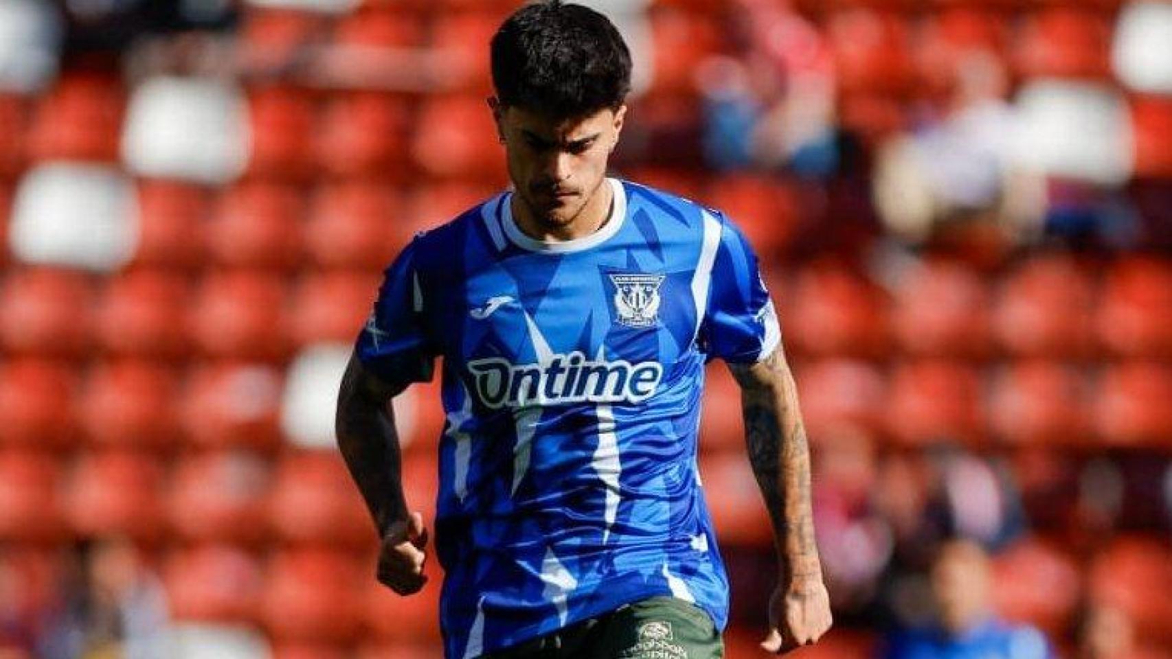 Un momento del calentamiento en el partido entre el Sporting y el Leganés.