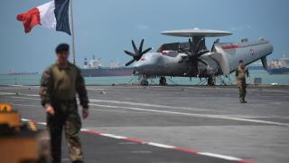 An E-2C Hawkeye on the deck of the French aircraft carrier Charles de Gaulle.