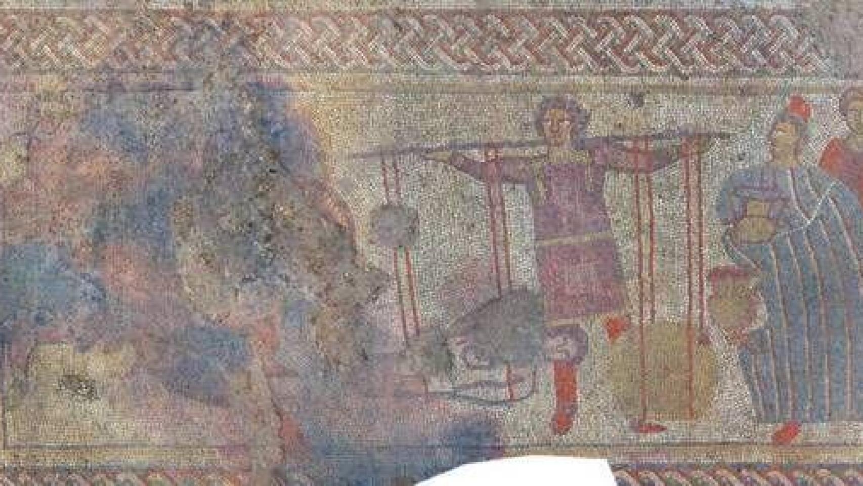 Un mosaico que reproduce a los troyanos pesando en oro el cuerpo de Héctor para recuperarlo.