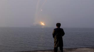 Kim Jong-un watches a missile launch from the destroyer 'Choe Hyon'.