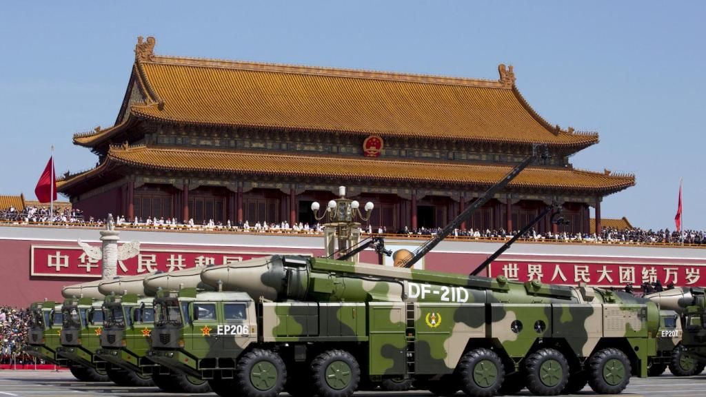 Chinese vehicles carrying DF-21D ballistic missiles at a parade in Tiananmen.