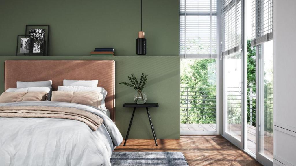 Dormitorio moderno en tonos verdes.