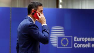 Pedro Sánchez, President of the Government, speaks by phone upon entering the European Council, in an archive image.