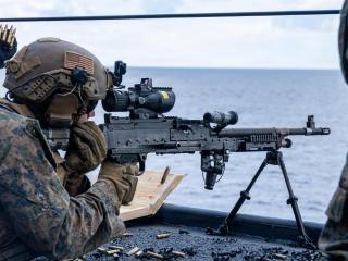 Members of the US Marine Expeditionary Unit practice shooting from the deck of the USS New Orleans
