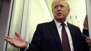 Donald Trump, aboard Air Force One during a flight back to Washington.