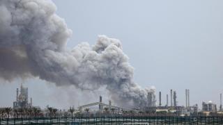A column of smoke rises after an attack on the Bapco oil refinery in Bahrain.