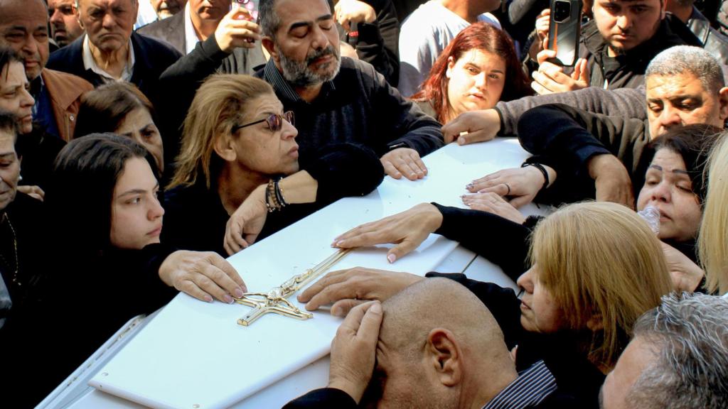 The white coffin of Father Pierre El Rahi.