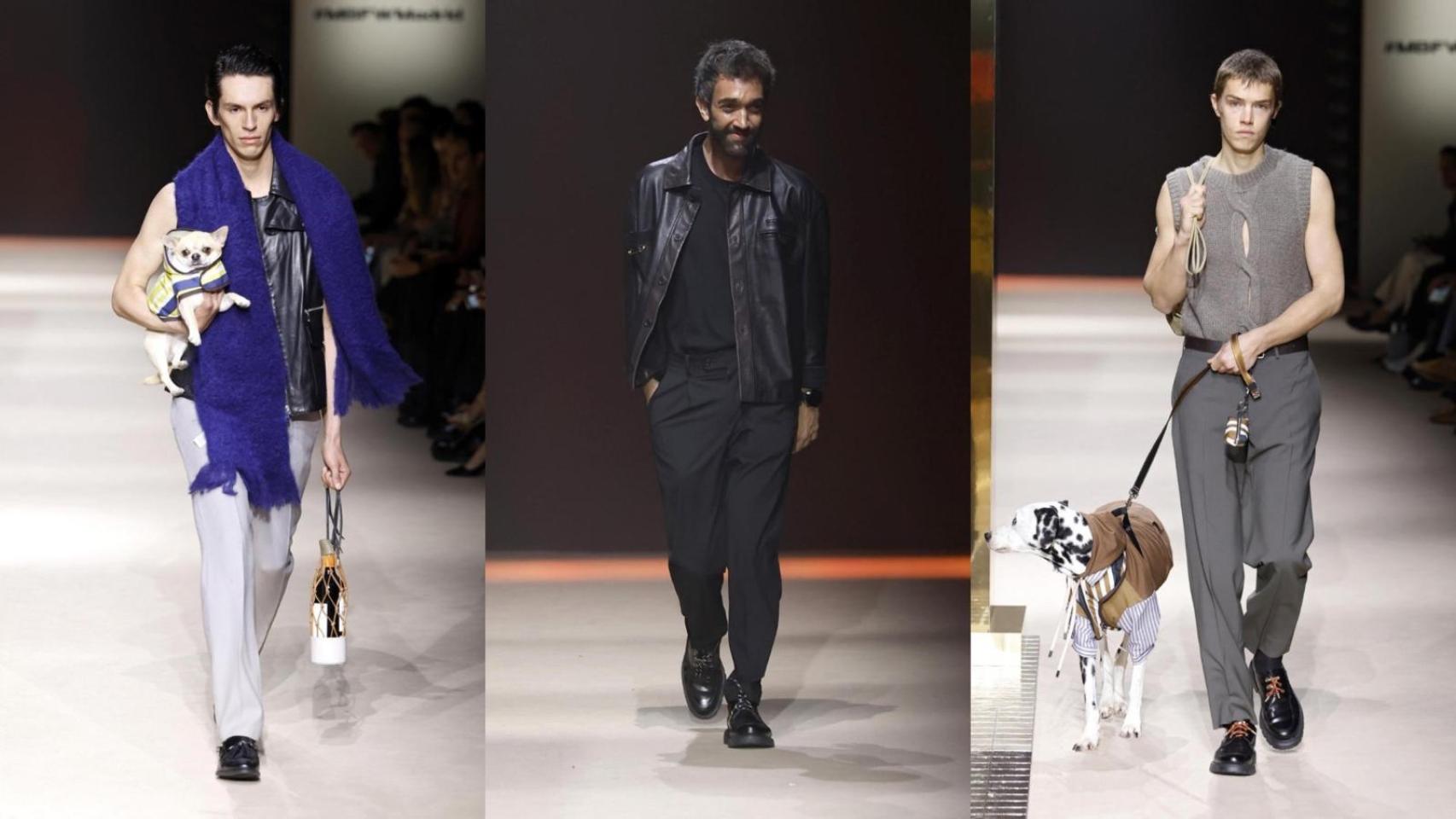 Dos modelos desfilando con los perros y Pablo Erroz, el diseñador, en el medio.