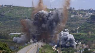 Smoke and flames rise after an Israeli attack on the Qasmiya bridge near Tyre, southern Lebanon
