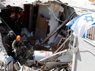Iran defies Trump's ultimatum to reopen Hormuz with bombing of civilians and main Israeli airport