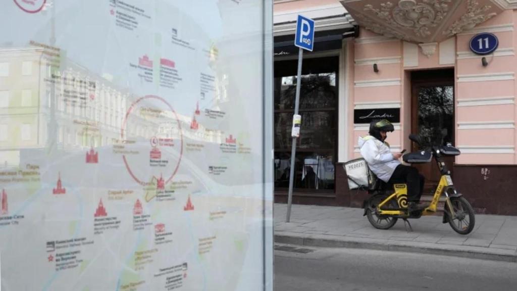 A delivery man checks where he should deliver orders in Moscow.