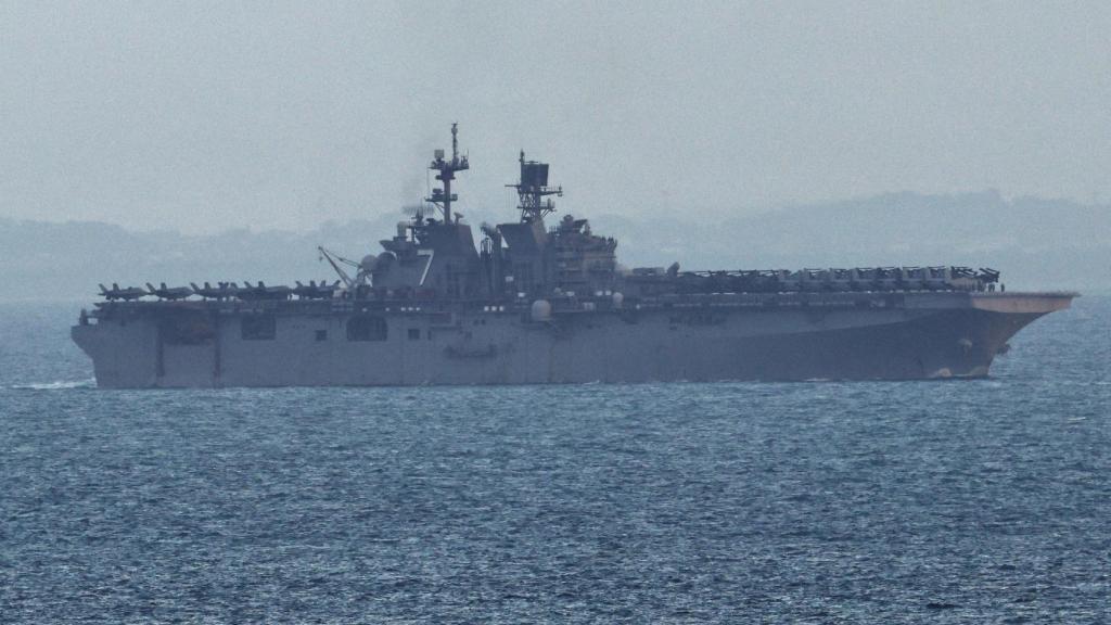 The amphibious assault ship USS Tripoli crosses the Singapore Strait on its way to the Persian Gulf.