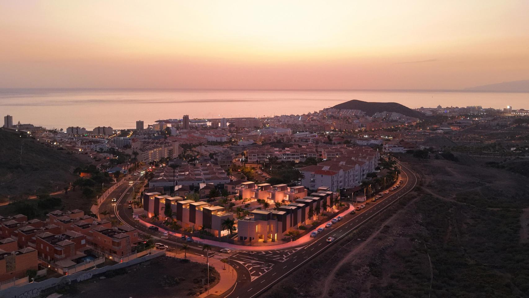 Simulación de la nueva urbanización ante un atardecer frente al Atlántico