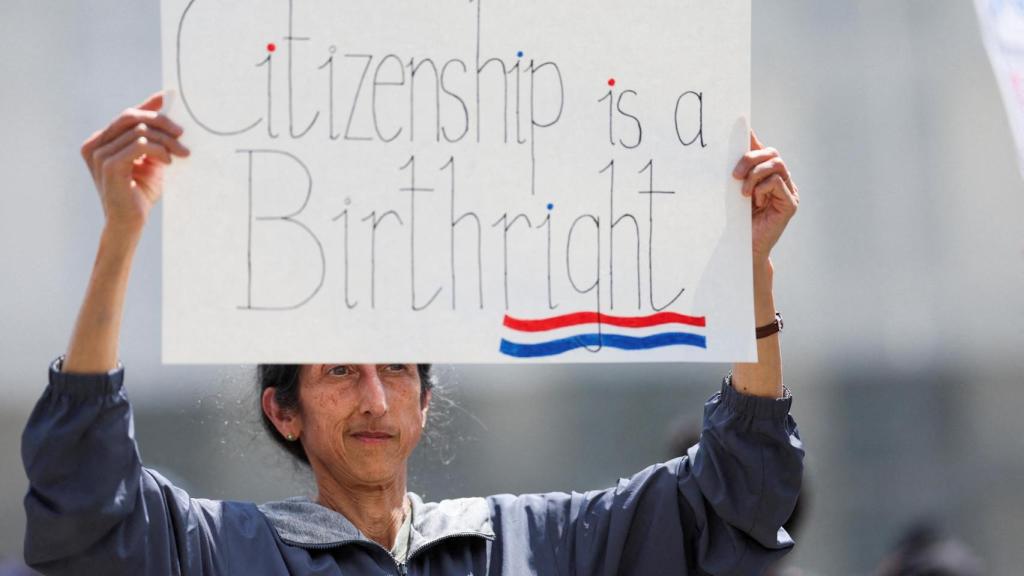 A protester in favor of citizenship by birth.