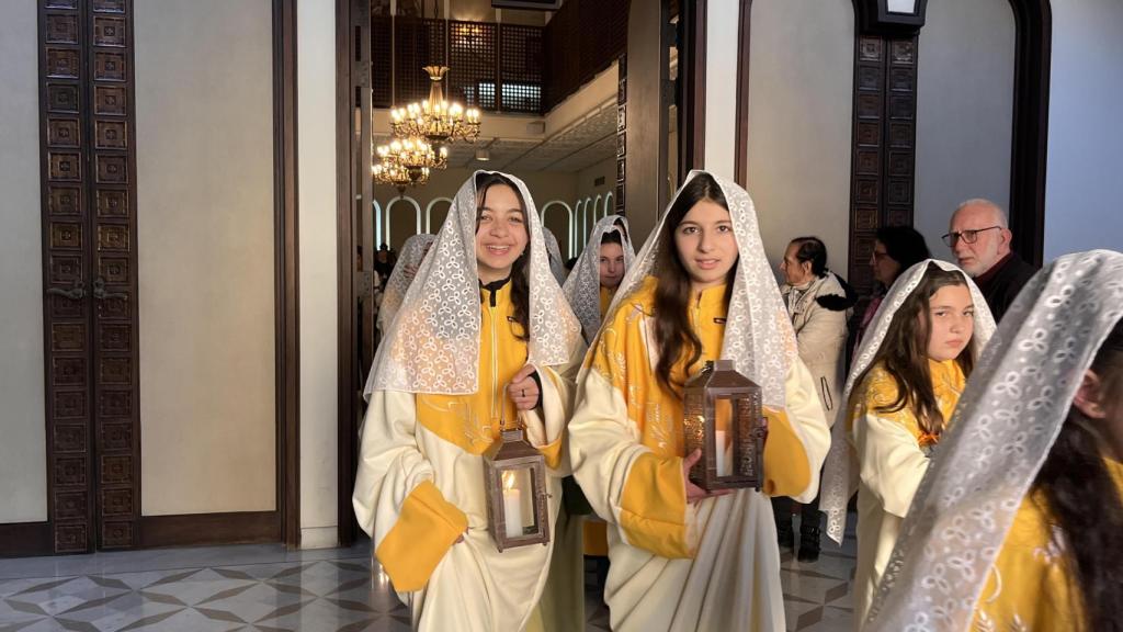 The girls visit the Armenian patriarch carrying candles.