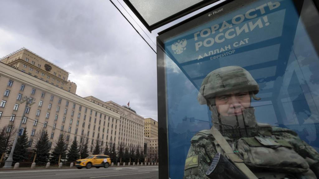 A marquee with military advertising in front of the Russian Ministry of Defense.