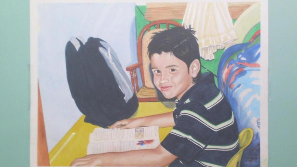 Daniel, en la mesa de su habitación estudiando. Su padre lo pintó.