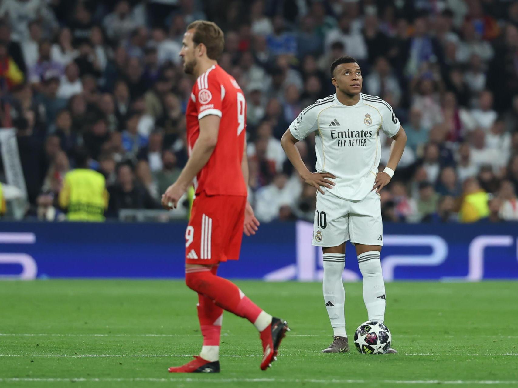Harry Kane y Mbappé, de fondo, durante el Real Madrid - Bayern