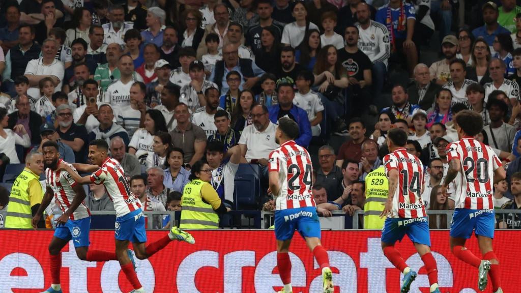 Girona players celebrate their goal at the Santiago Bernabéu.