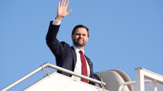 U.S. Vice President JD Vance waves as he boards Air Force Two following peace talks with Iran in Islamabad, Pakistan, Sunday, April 12, 2026.