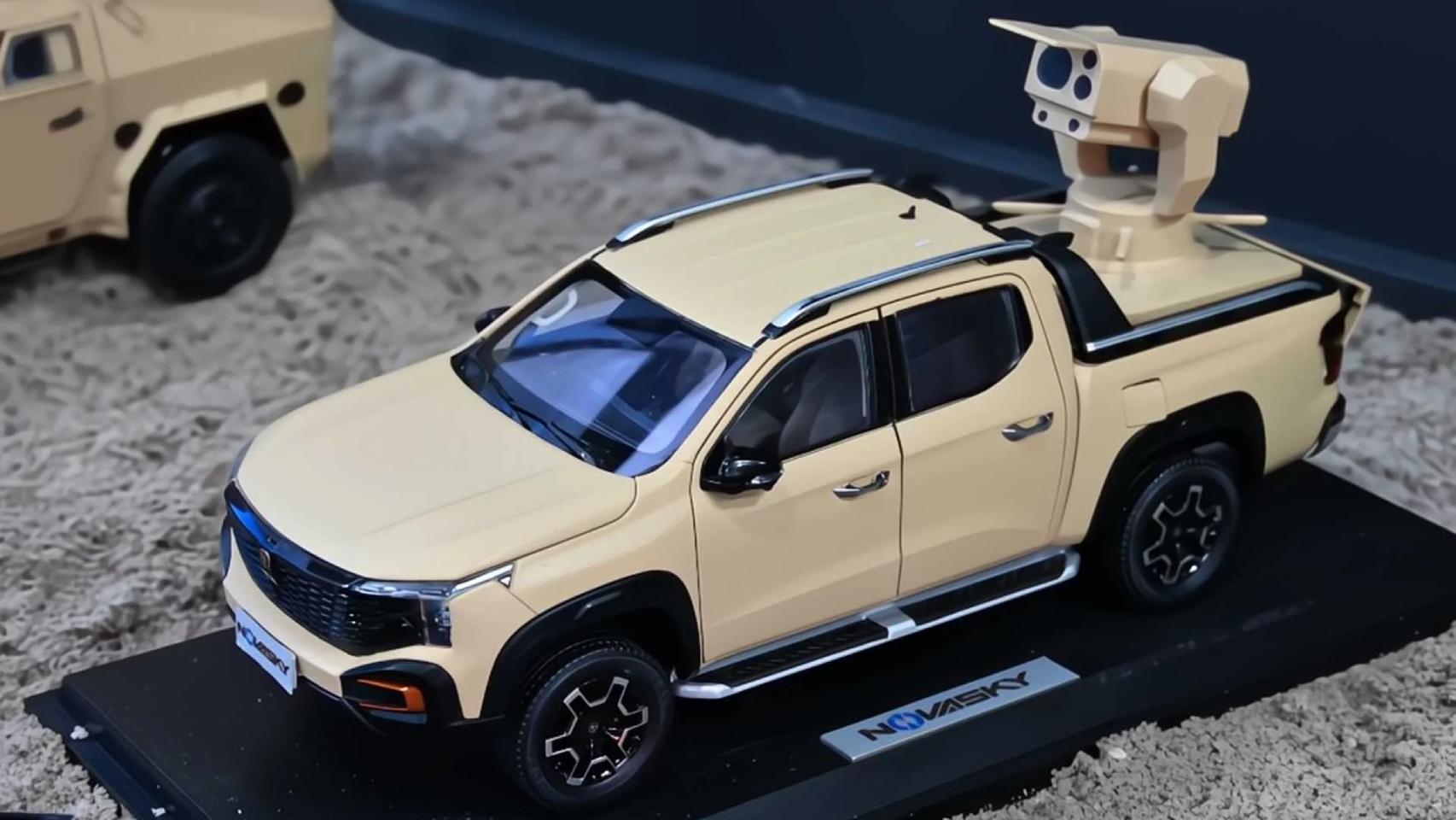 Maqueta del nuevo láser antidrones montado en un camión de China.