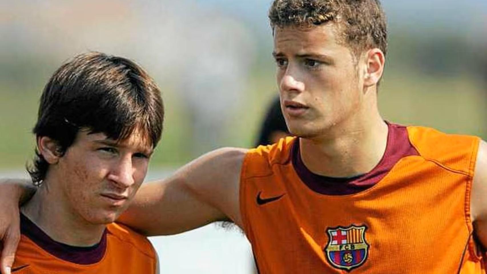 Oriol Riera, junto con Messi.