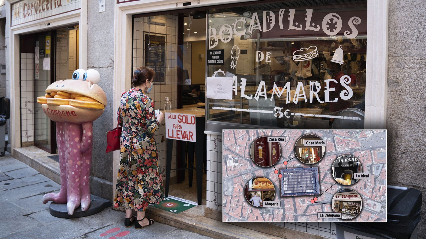 Una mujer espera a ser atendida en uno de los bares más emblemáticos de Madrid.
